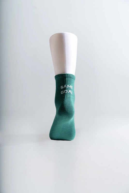 Sukat tekstillä tummanvihreä